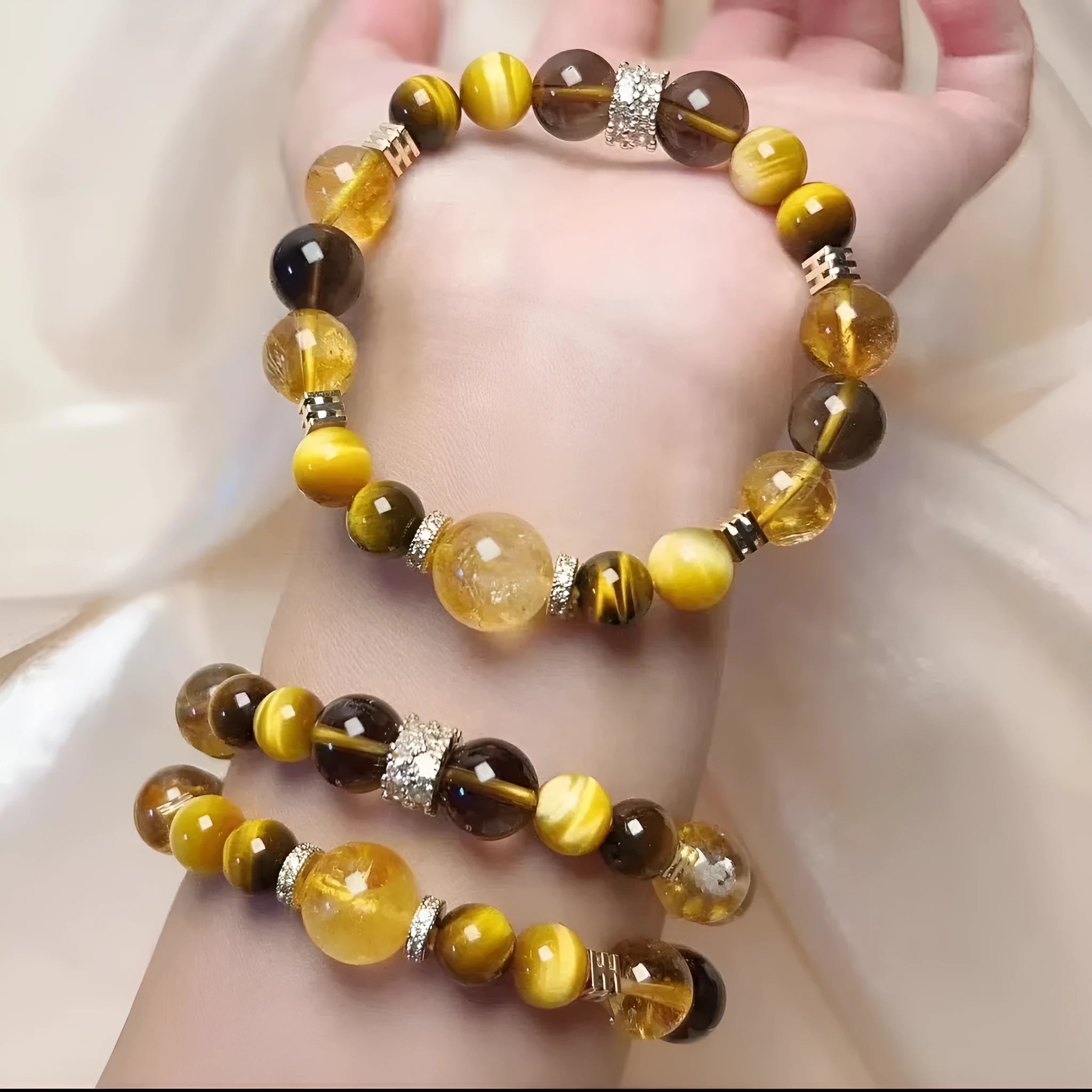Close-up of a women's bracelet with large 10mm natural yellow artificial crystal beads on a string.