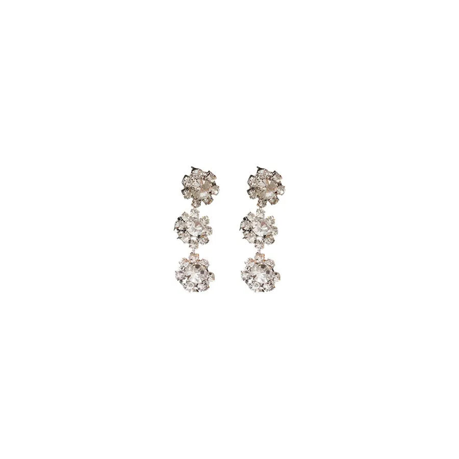 Diamond sunflower earrings and necklace set in silver finish on display