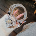 Three-dimensional butterfly USB cable protection sleeve in silver foil for data cable organisation