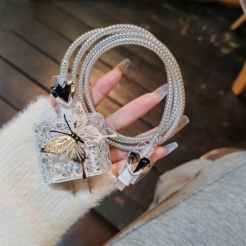 Three-dimensional butterfly USB cable protection sleeve in silver foil for data cable organisation