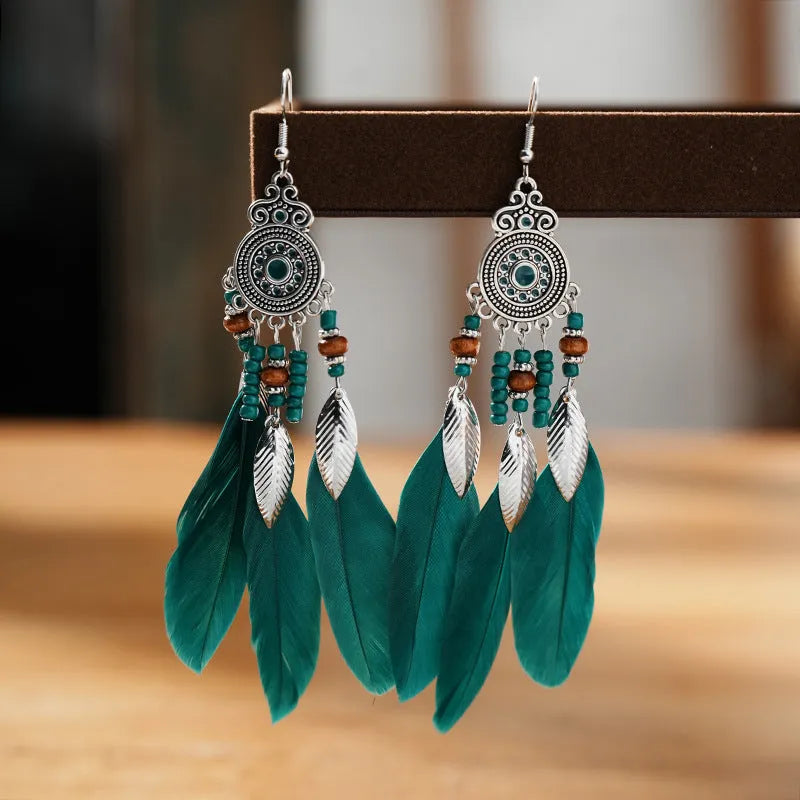Round drop feather design alloy earrings with leaf pattern in a bohemian style, showing electroplated finish.