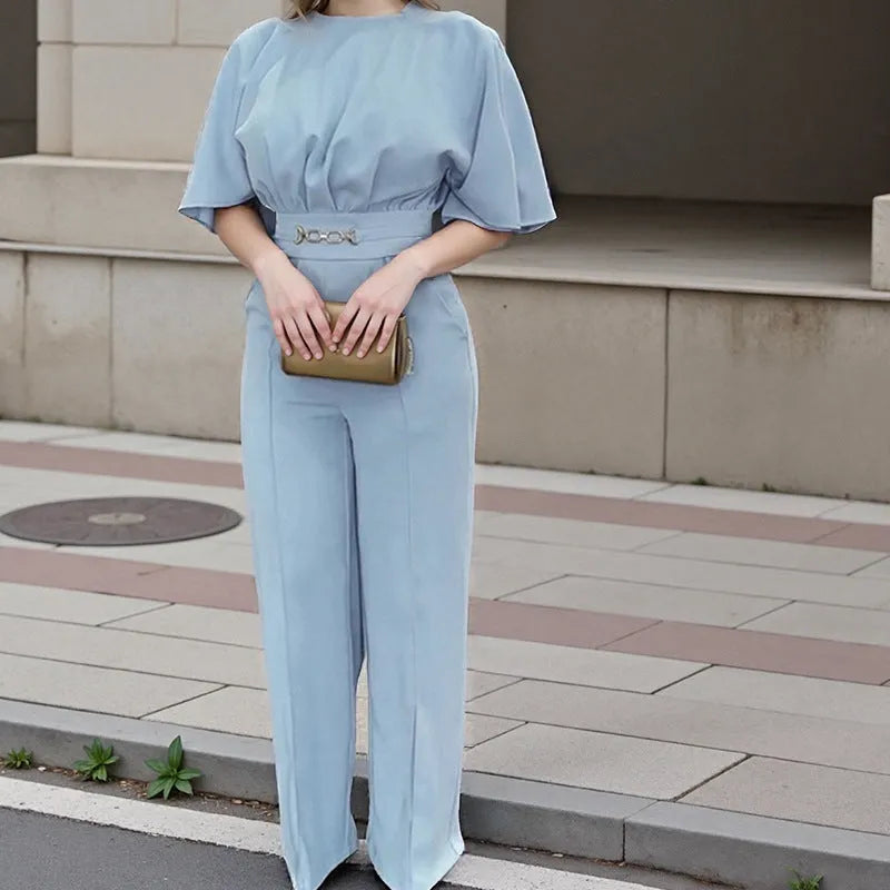 Blue polyester men's suit comprising trousers and a long-sleeve shirt, laid flat.