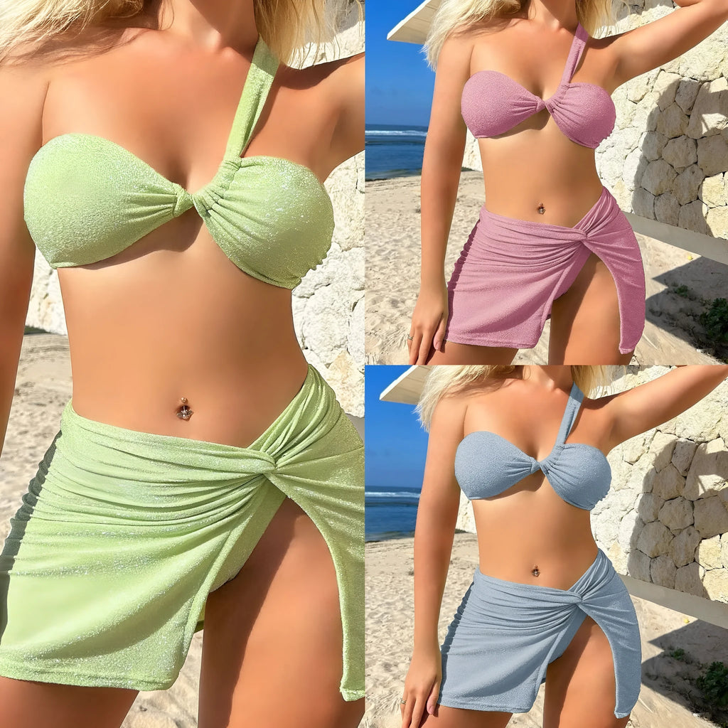 Light green one-shoulder tube top three piece swimsuit set for women with matching briefs and skirt.