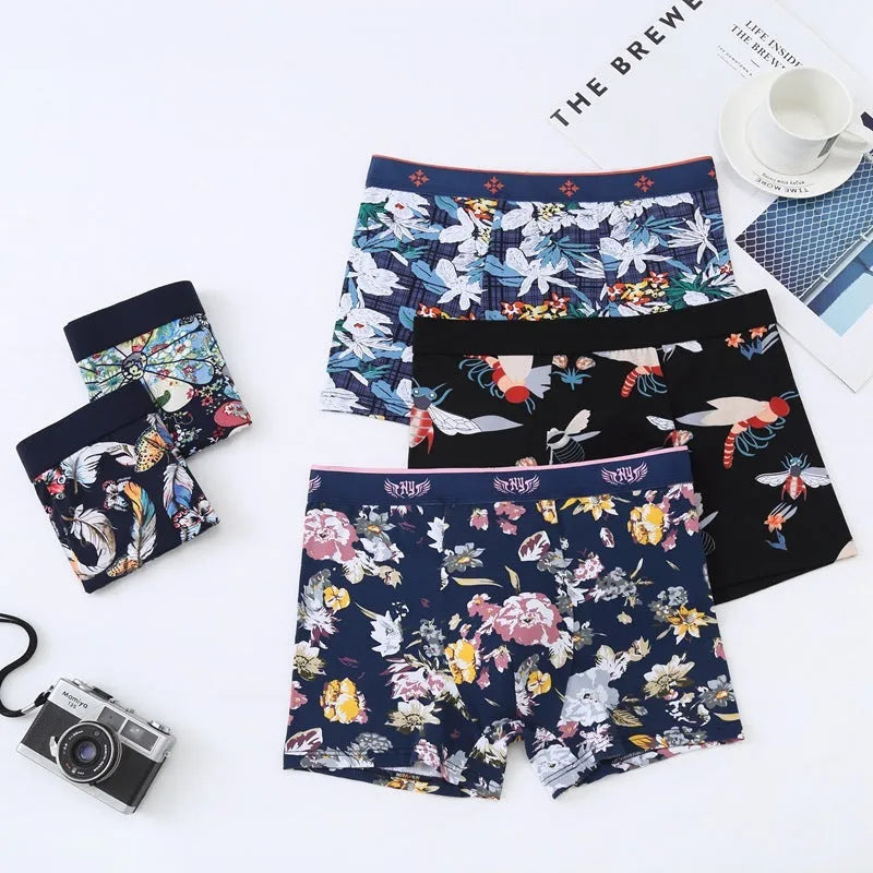 Men's floral print cotton boxer shorts showing mid-waist fit and U-shaped convex design.