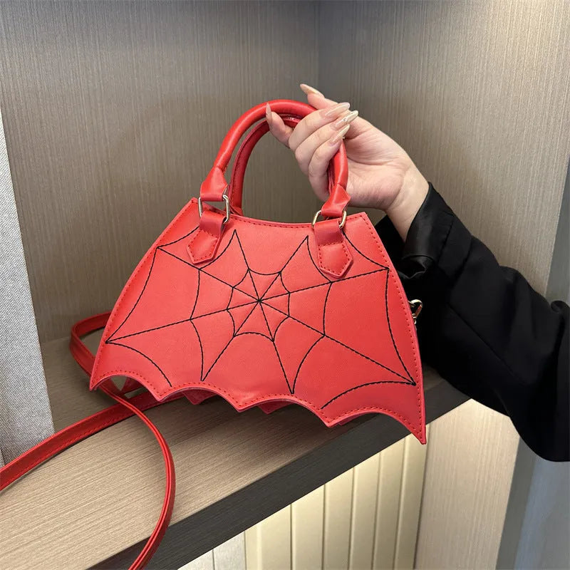 Women's small square PU saddle bag with spider web pattern, crossbody strap, and top handle, available in six colours including black and red