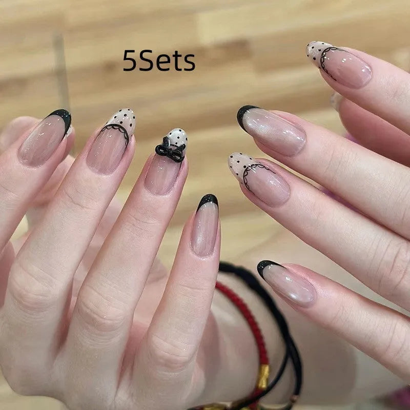 Set of sweet girl themed false nail tips with various designs for short to medium natural nails.