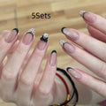 Set of sweet girl themed false nail tips with various designs for short to medium natural nails.