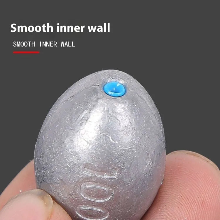 Rugby-shaped olive fishing lead sinker with scale tongxin and plastic core, weights from 10g to 150g.