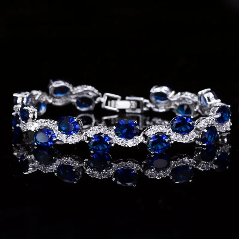 Electroplated copper bracelet with zircon stones in geometric design showing gold colour finish
