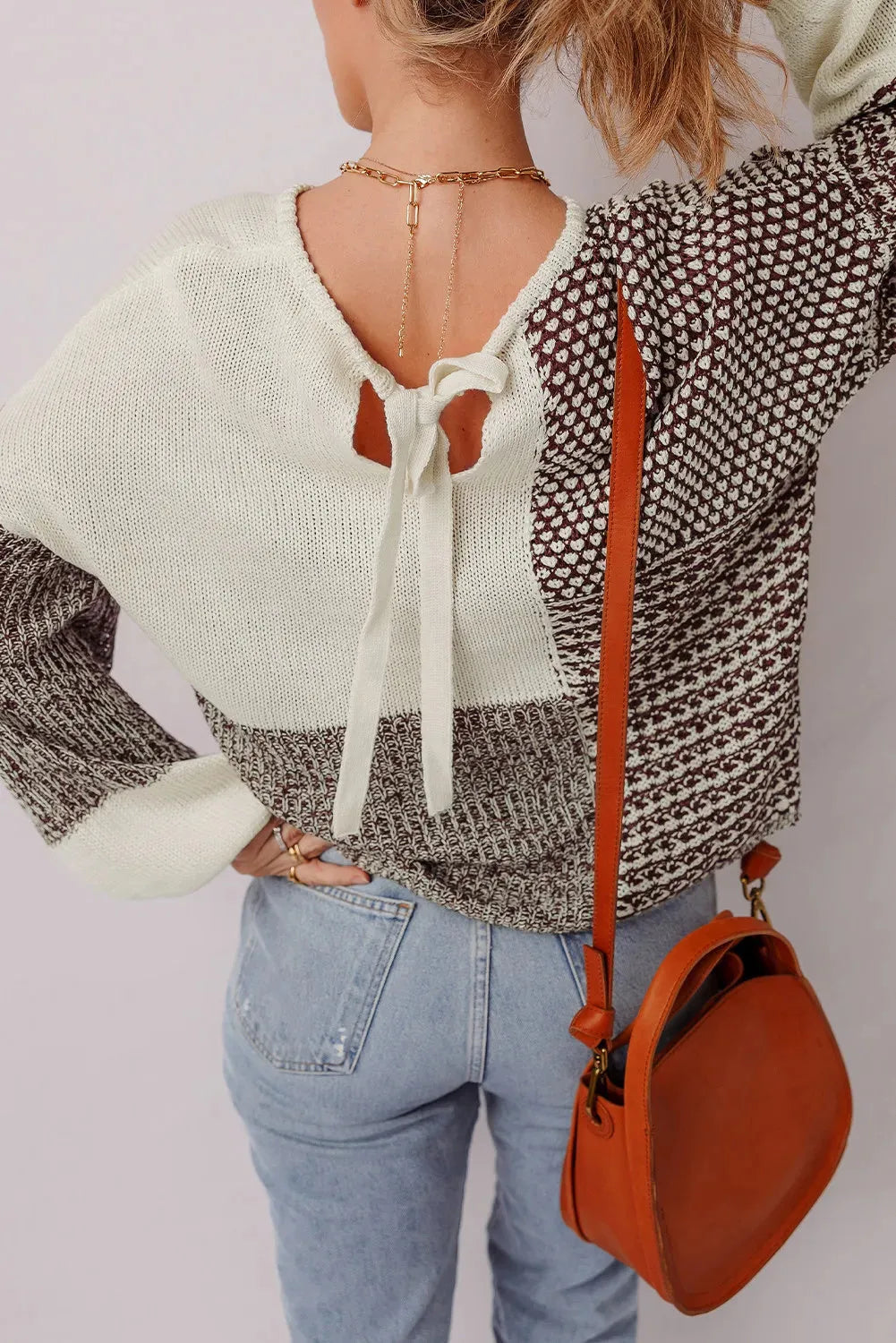 Dark khaki loose sweater with drop shoulders and a back tie fastening.