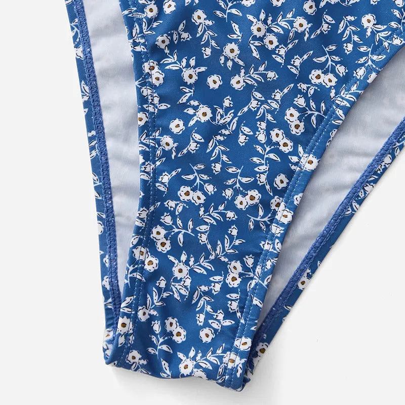 Blue polyester three-piece women's swimsuit set with top and shorts