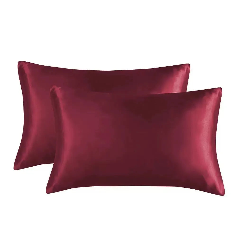 Pair of solid colour satin cloth pillowcases showing colour options including navy blue, wine red and light pink