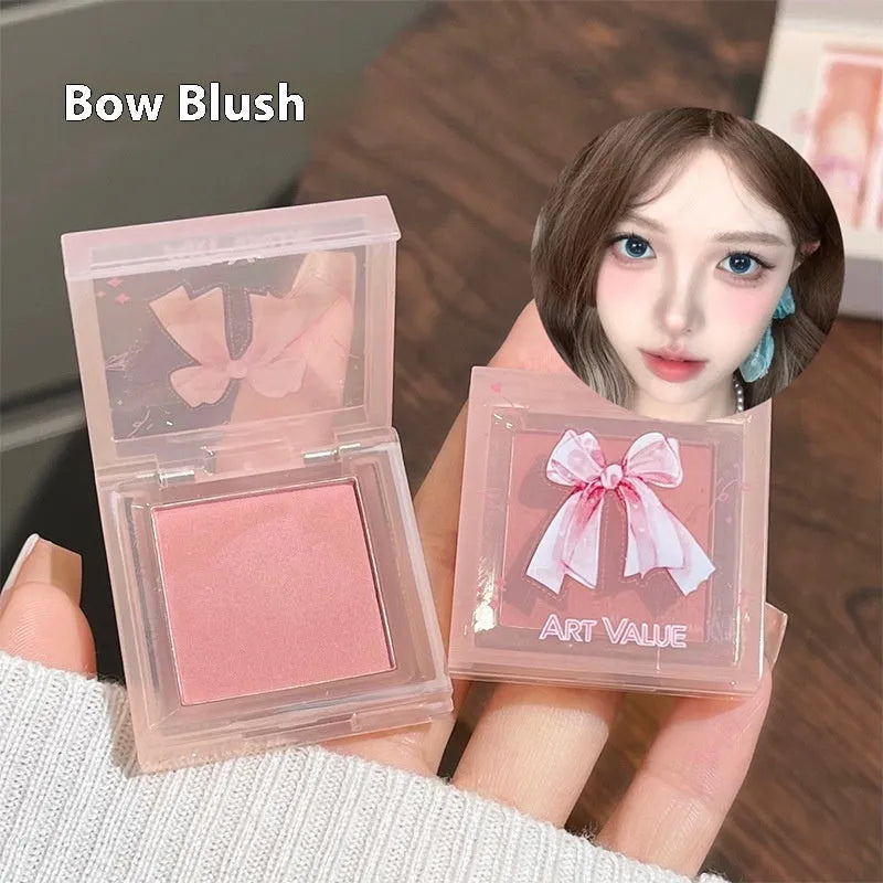 Butterfly Box makeup set with four pink matte lip muds, powder blusher, and matching necklace