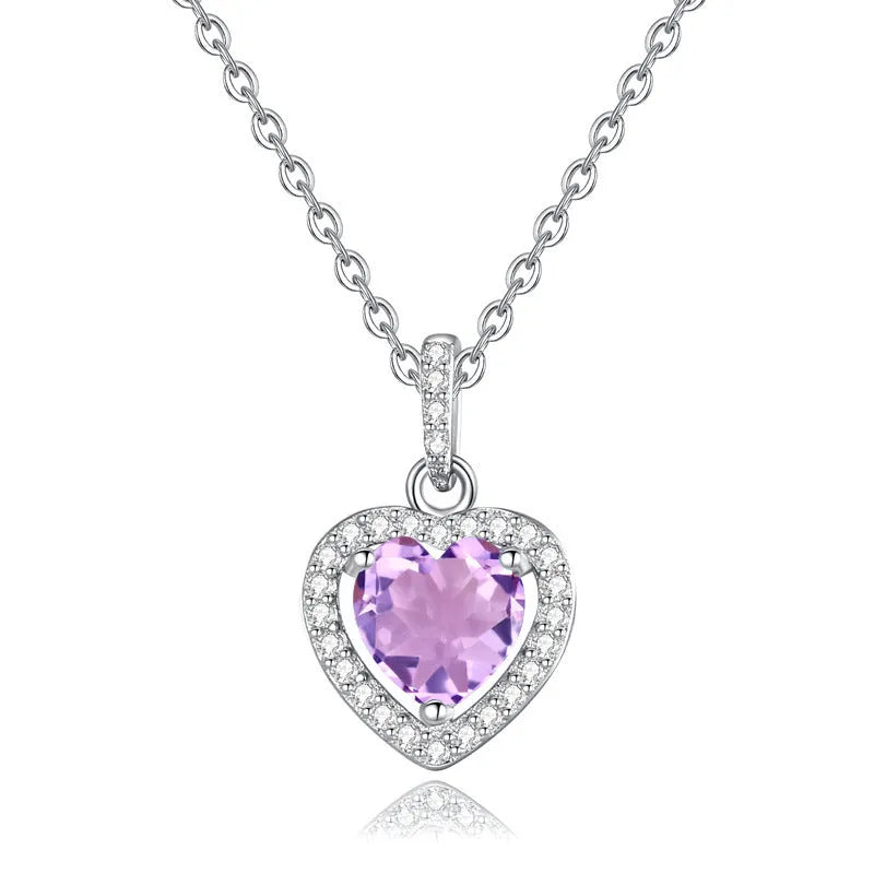 Sterling silver heart pendant necklace with a natural coloured gemstone on an adjustable cross chain.
