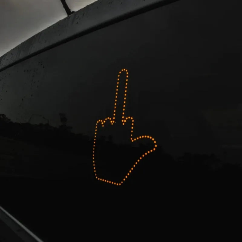 Black plastic car gesture light with LED illuminated hand gesture, remote control, and 3M Velcro mounting