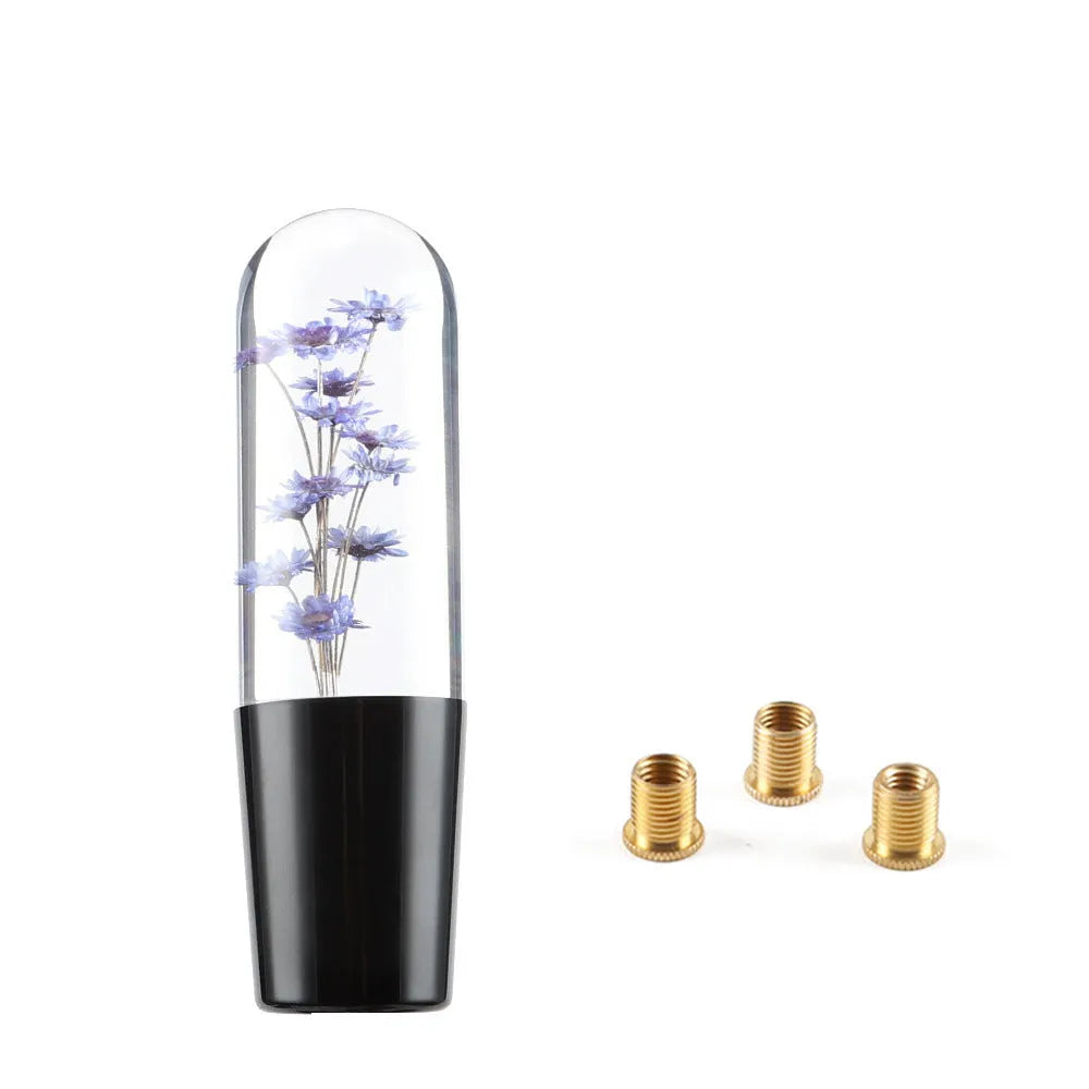 Transparent crystal car gear shift knob in assorted colours with three metal adapters.