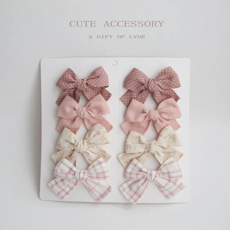 Children's cloth hairclips with dovetail bow decoration in multiple colour options
