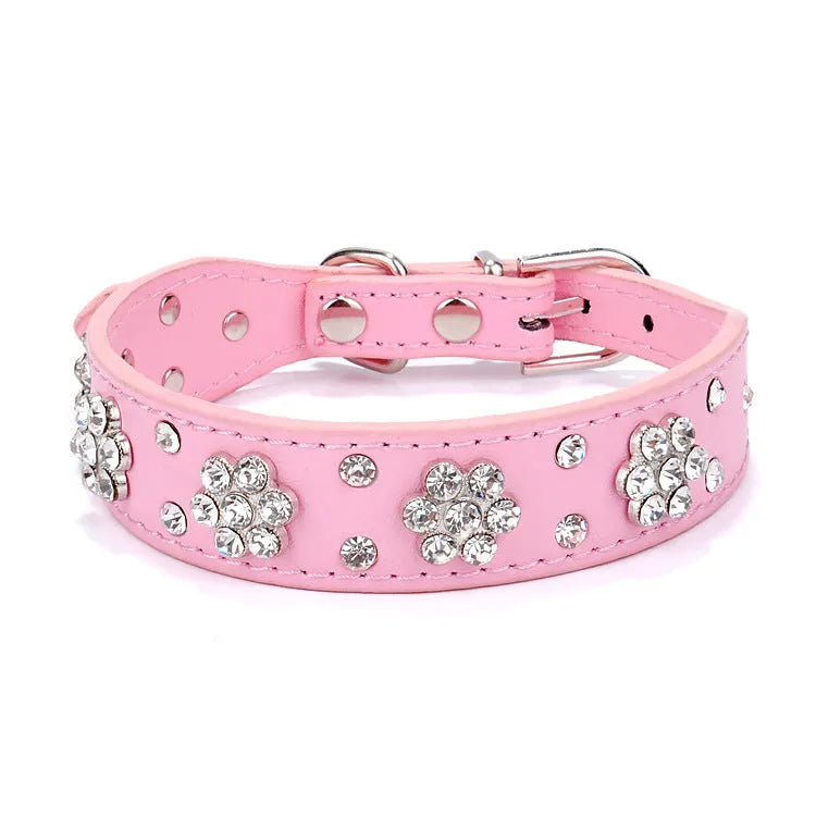 Decorative black PU leather dog collar with studded rhinestone flower pattern and silver metal D-ring.
