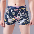 Men's floral print cotton boxer shorts showing mid-waist fit and U-shaped convex design.