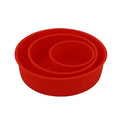 Red round silicone cake mould on a baking tray showing 8 inch size with smooth interior
