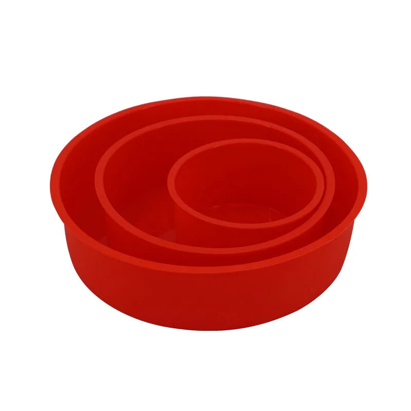 Red round silicone cake mould on a baking tray showing 8 inch size with smooth interior