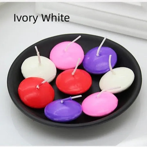 Ivory white cylindrical floating candles made of paraffin wax in a 10 pack for wedding decor