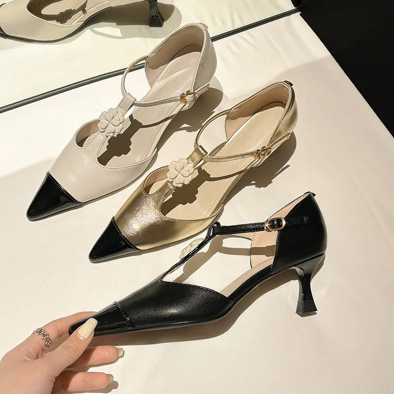 Gold women's stiletto heel shoe with floral buckle and pointed toe on a shallow 7-11cm cut.