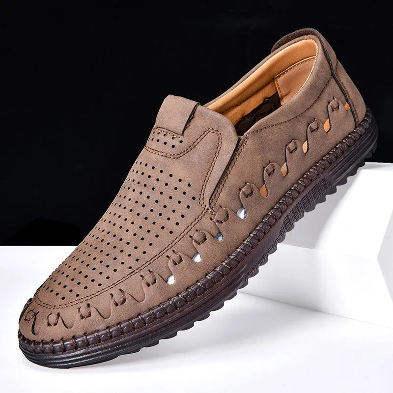 Men's brown slip-on casual leather shoes with round toe and flat heel on a white background.
