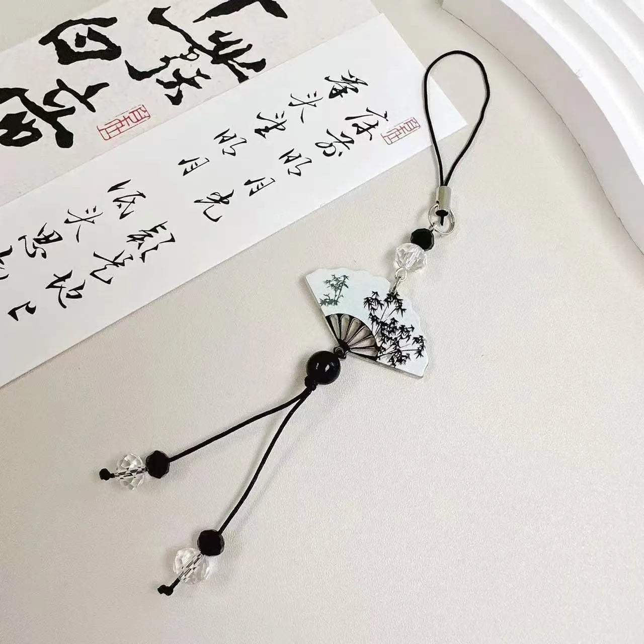 Guofeng ceramic bead pendant keychain with hand-painted Chinese fan and floral design.