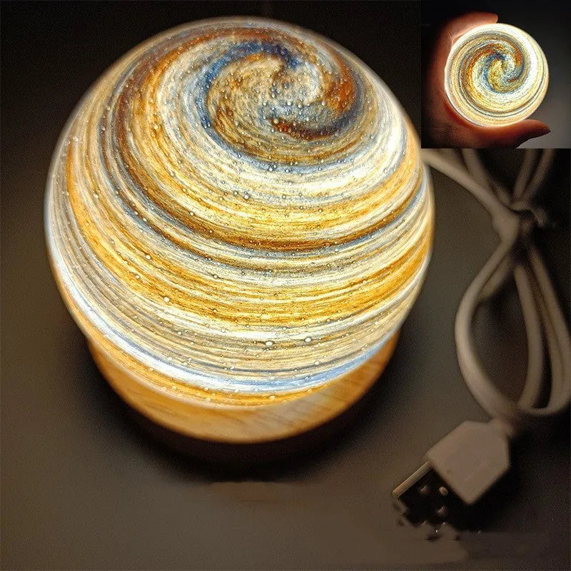 Planet night light with USB cable and base in modern simple design showing spherical shape