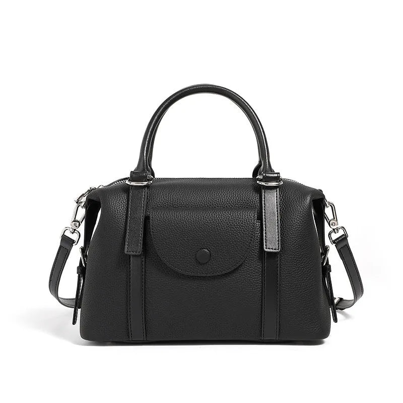 Genuine leather ladies handbag in street trend style with contrast stitching and lock detail.