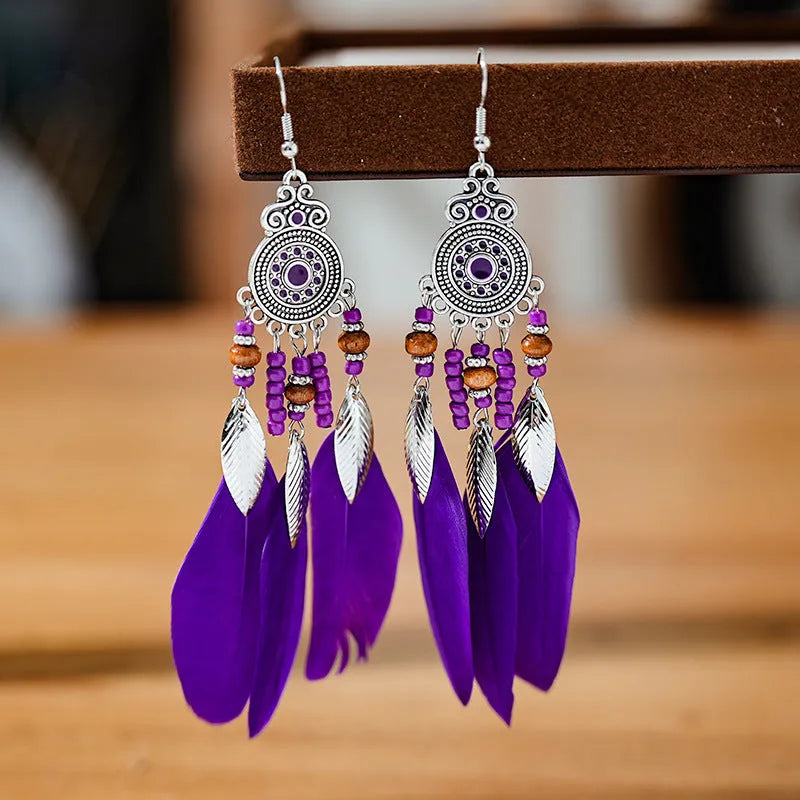 Round drop feather design alloy earrings with leaf pattern in a bohemian style, showing electroplated finish.