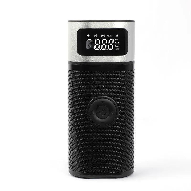 Black portable wireless air pump with USB charging cable, inflation tube, and a set of nozzles on a grey background.