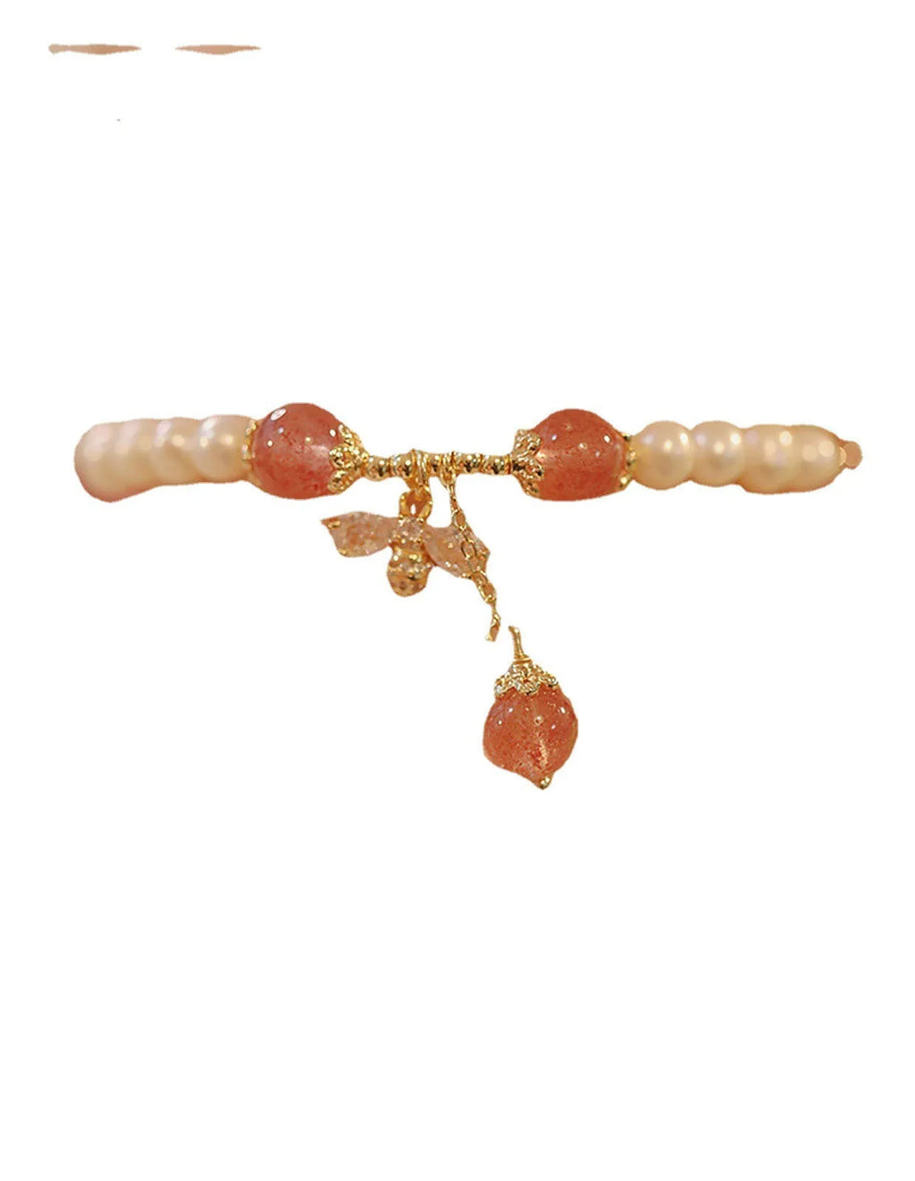 Women's strawberry quartz crystal bracelet with pearls and bow charm on wrist