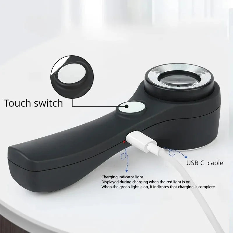 Black and silver metallic appraisal magnifying glass with 30mm optical glass lens and USB-C cable.