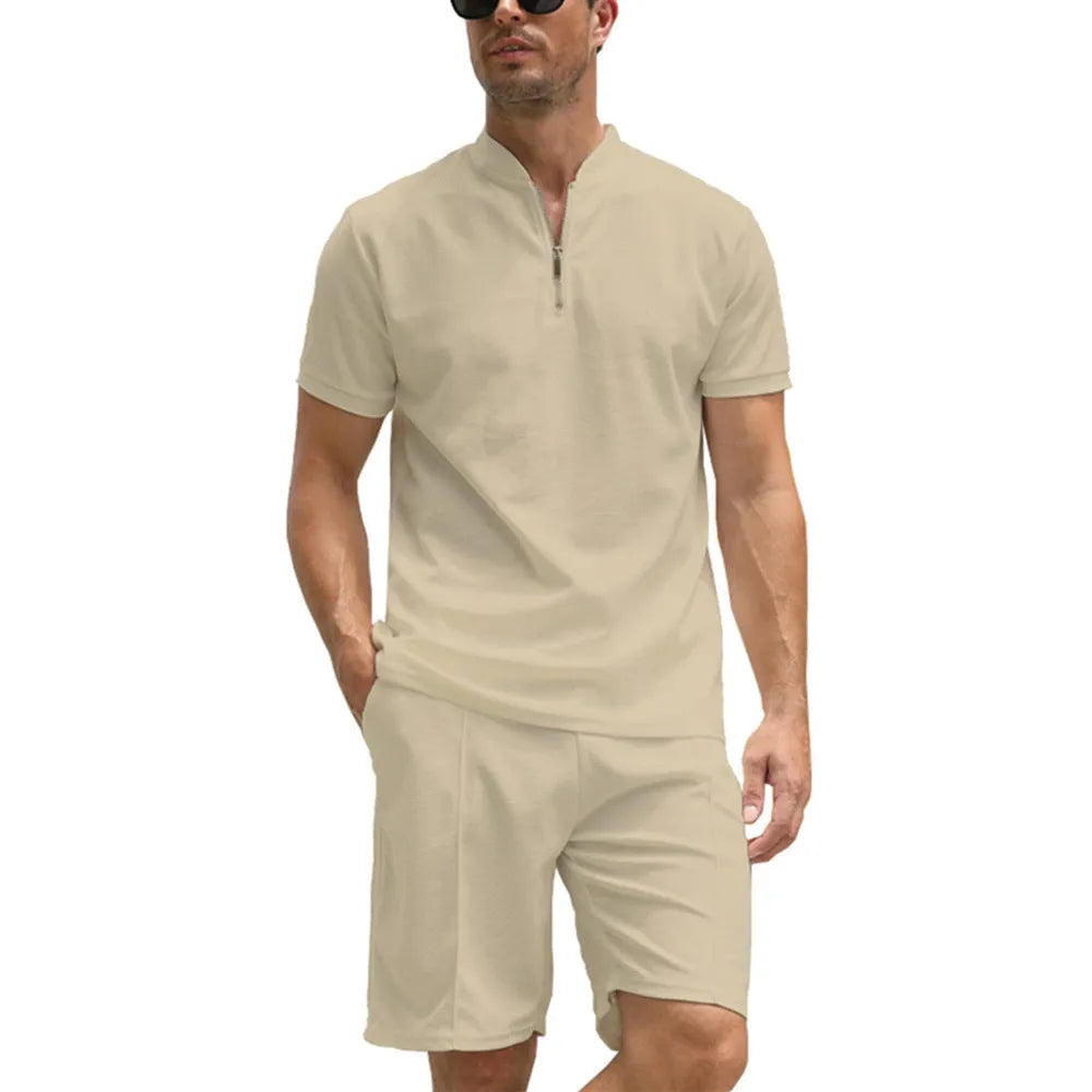 Man wearing a solid colour polo shirt and matching trousers from a two-piece set in beaded bird's eye polyester fabric.