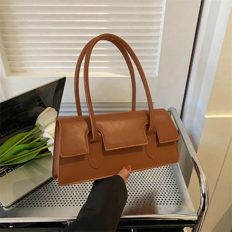 Women's horizontal square shoulder bag in PU leather with decorative stitching and single strap