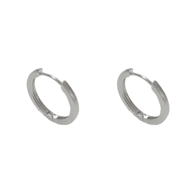 Geometric women's ear clip jewellery with simple eyelet design in gold or silver colour