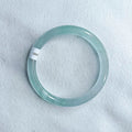 Azure light blue water ice quartzite jade thin round bar bracelet on white background