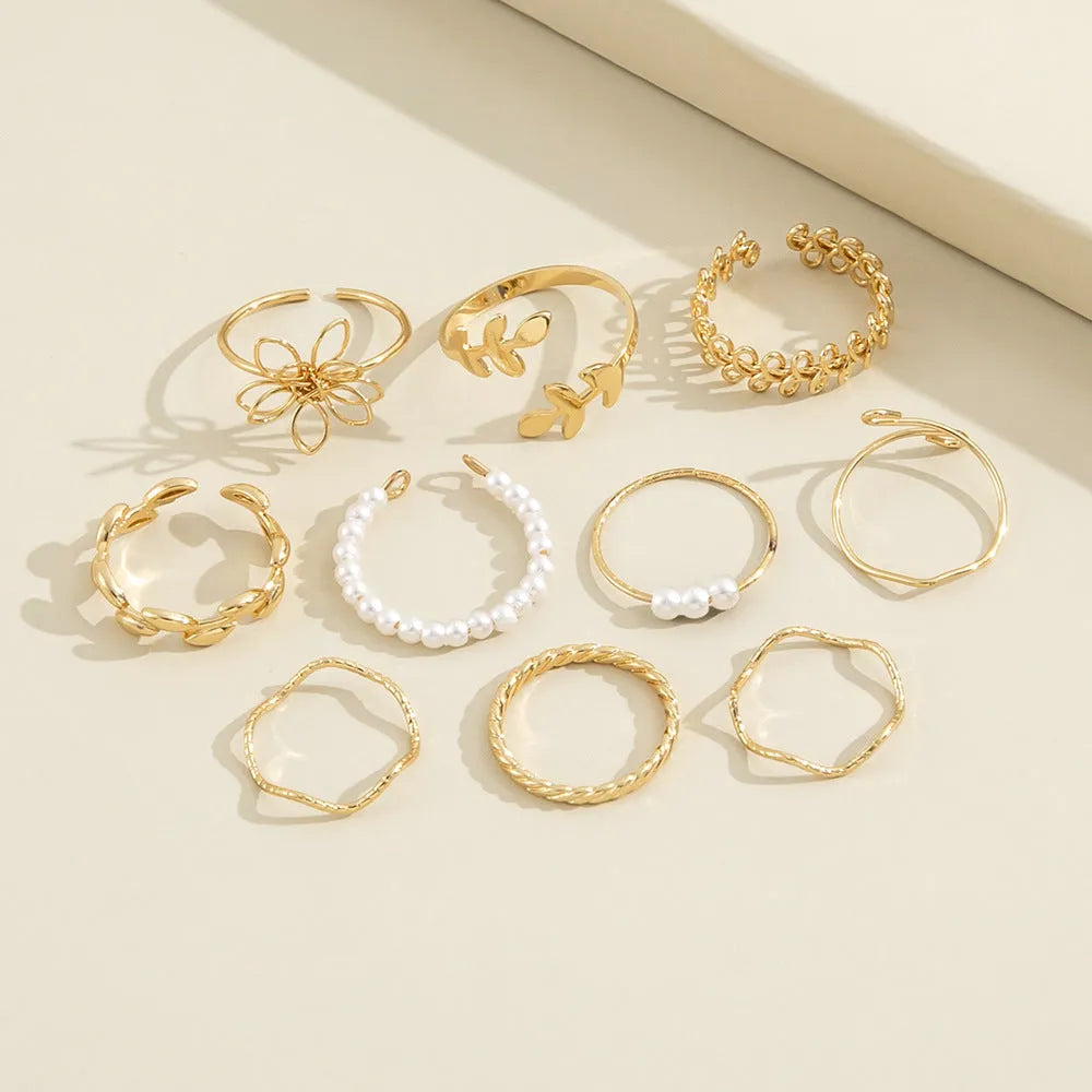 Openwork flower set ring with glossy gold finish showing floral pattern detail