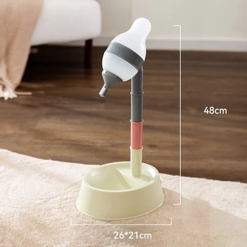 Green adjustable pet water dispenser showing height adjustment bars and ball-tip drinking nozzle