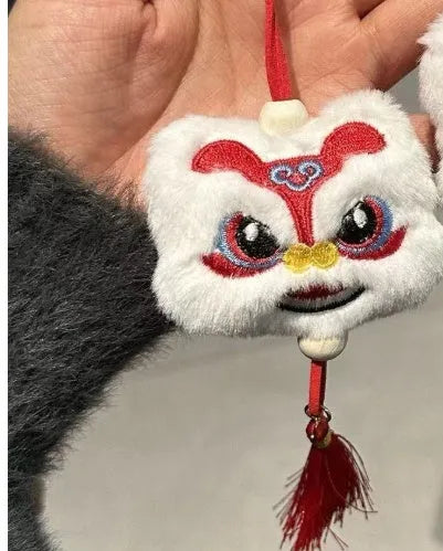 Blue and yellow handmade plush lion keychain with star stones and tassels in Chinese cartoon style