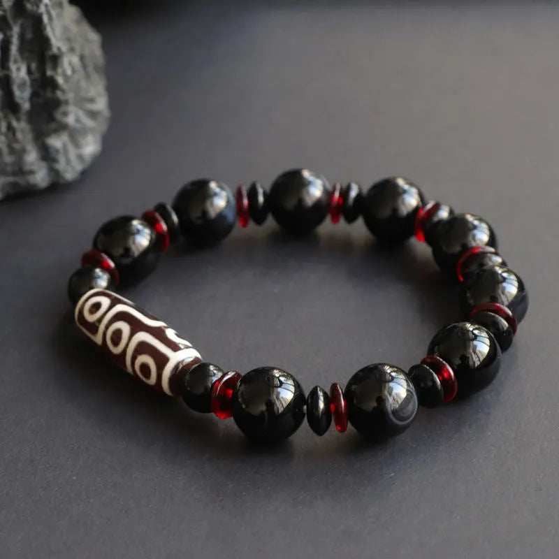 Black agate Dzi bead bracelet with hand-woven geometric pattern in national style design
