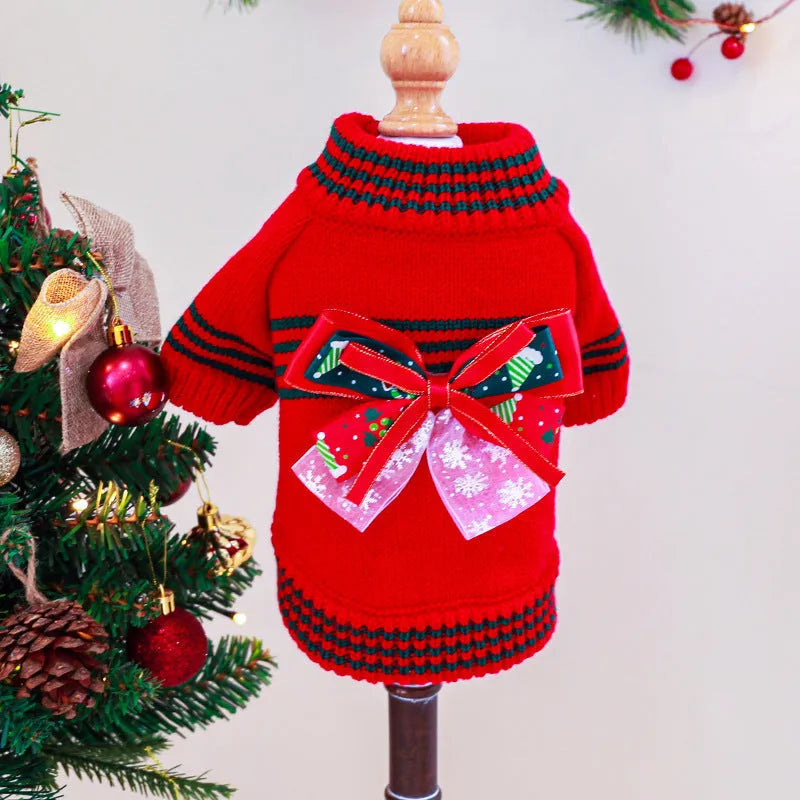 Red polyester Christmas dog jumper on small dog showing festive patterns and pullover design