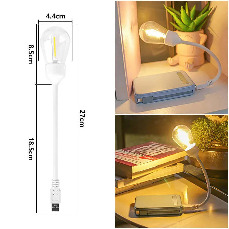 USB rechargeable folding night light with a glowing tungsten filament bulb on a table.