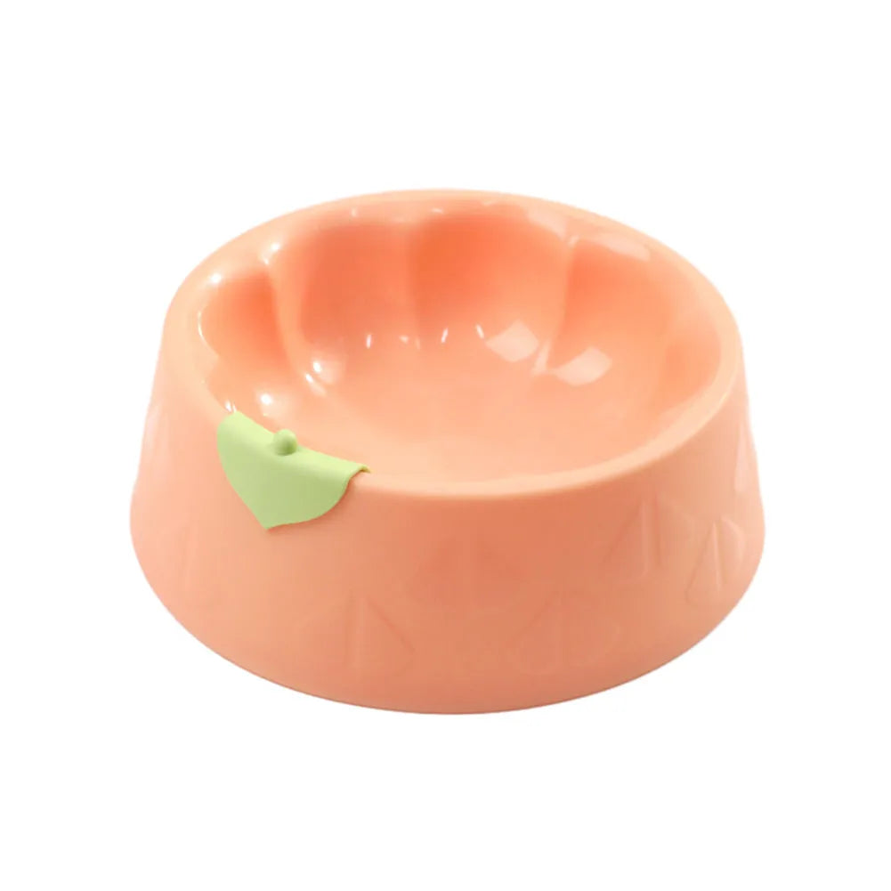 Green plastic double pet bowl for dog and cat food and water on a white surface