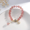 Korean style strawberry quartz bracelet with floral charm and silver accents