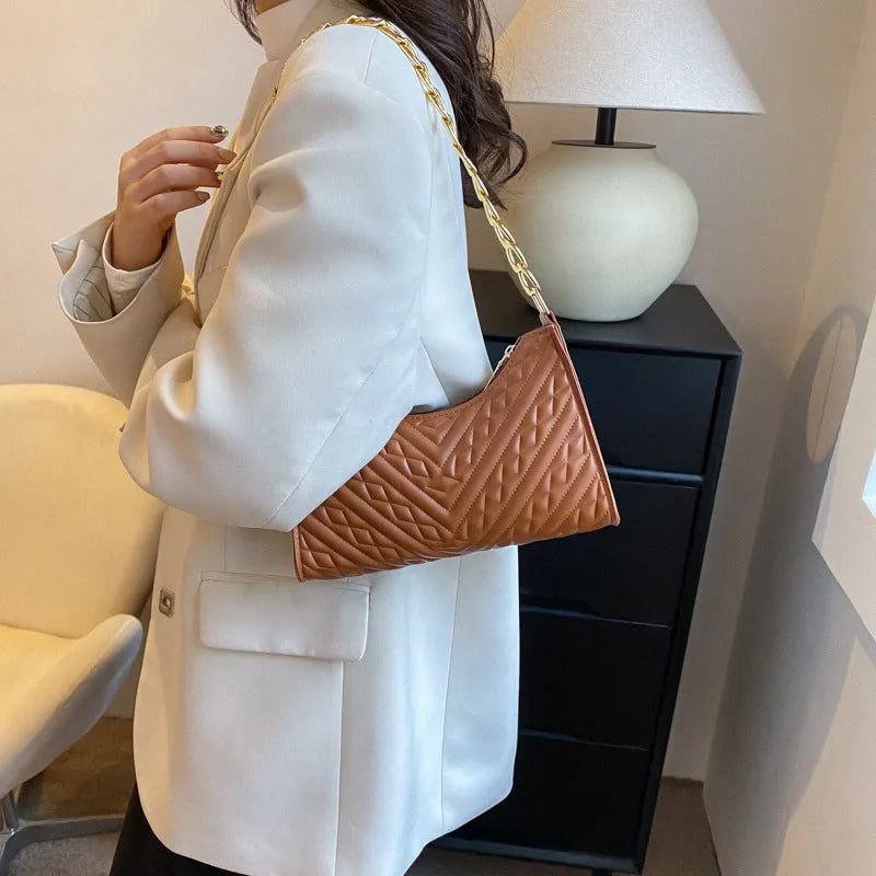 PU leather pleated chain baguette bag in vertical square shape with shoulder strap and carry handle