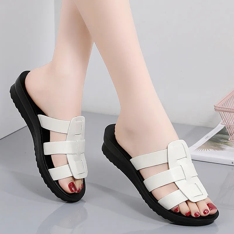 Women's large size soft sole slippers in beige, black and brown colours with flat bottom design