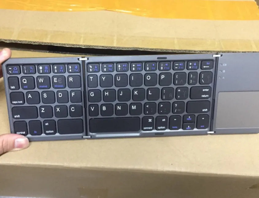 Ultra-thin tri-fold folding touch Bluetooth keyboard in black with touchpad, folded and spread views